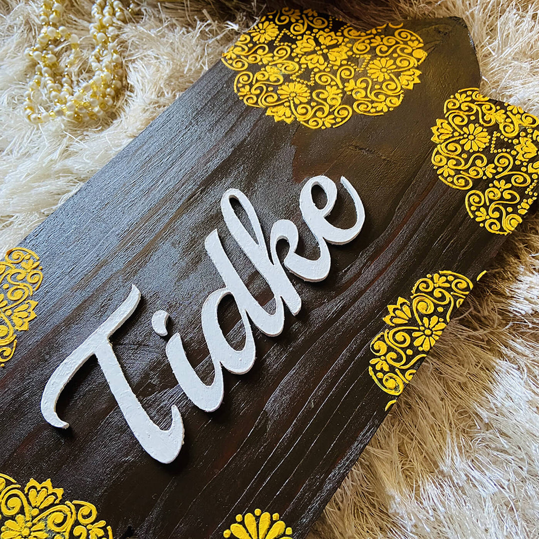 Handcrafted Personalized Curvy Pinewood Textured Name Plate - Angled Close-up Showing Lettering