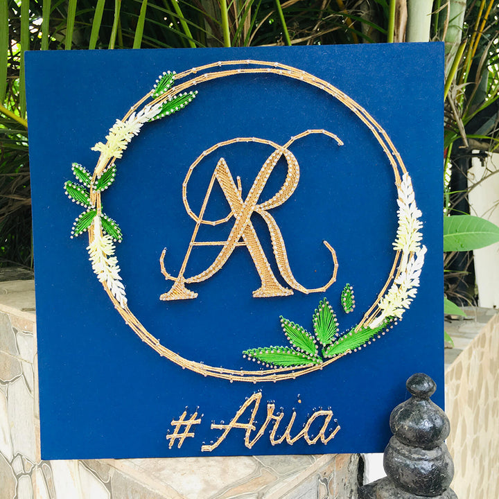Wedding Couple Initials String Art With Leaf Wreath - Front View on Outdoor Display