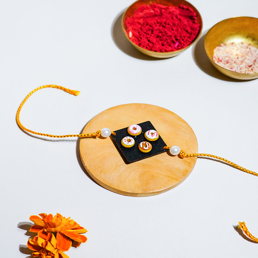 Handmade Food Themed Clay Rakhi 5 - Close-up on single rakhi