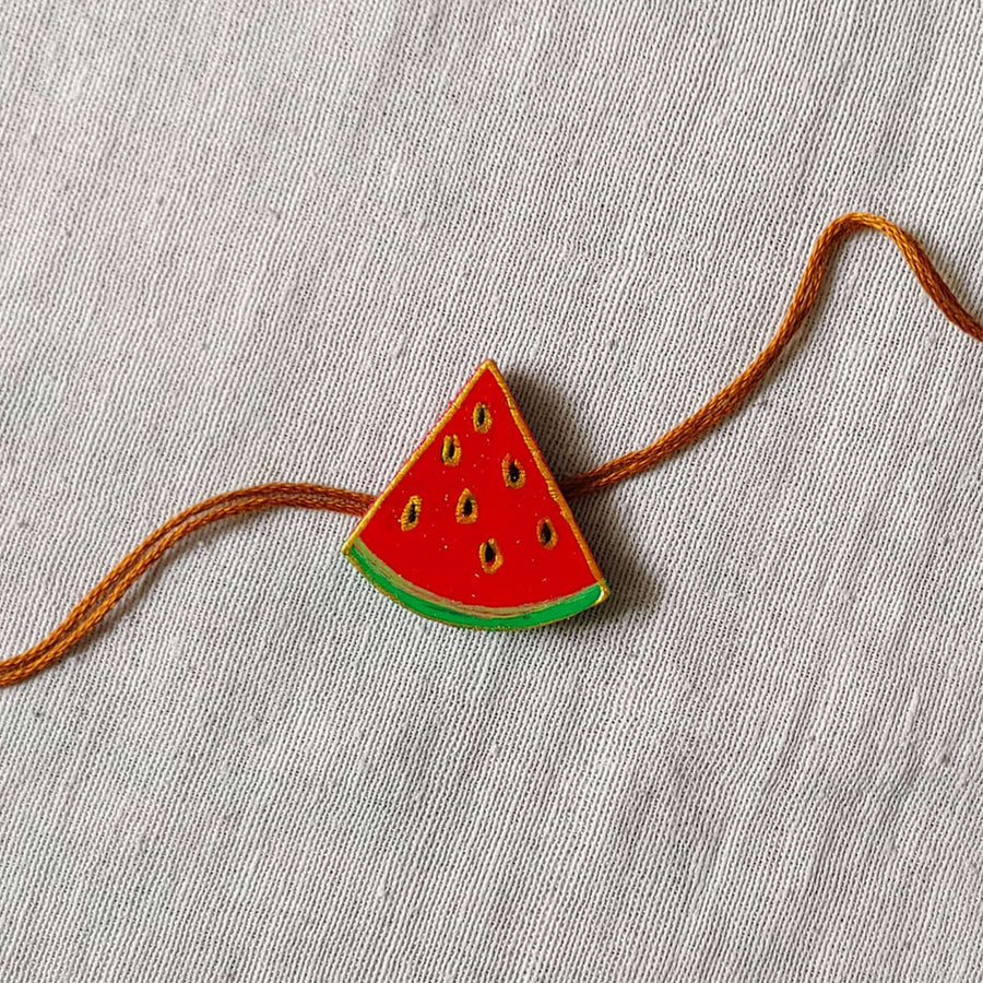 Handpainted Quirky Wooden Rakhi With Roli Chawal 4 - Close-up on Watermelon Rakhi