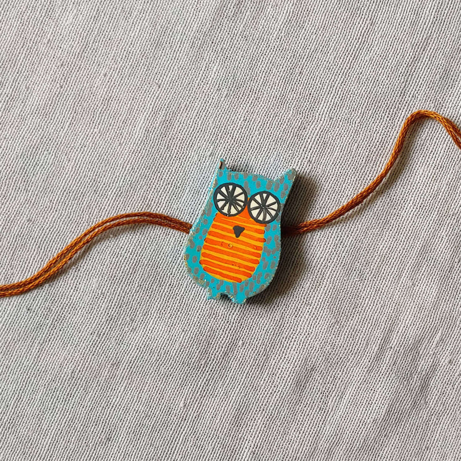 Handpainted Quirky Wooden Rakhi With Roli Chawal 8 - Single Owl Rakhi Close-up