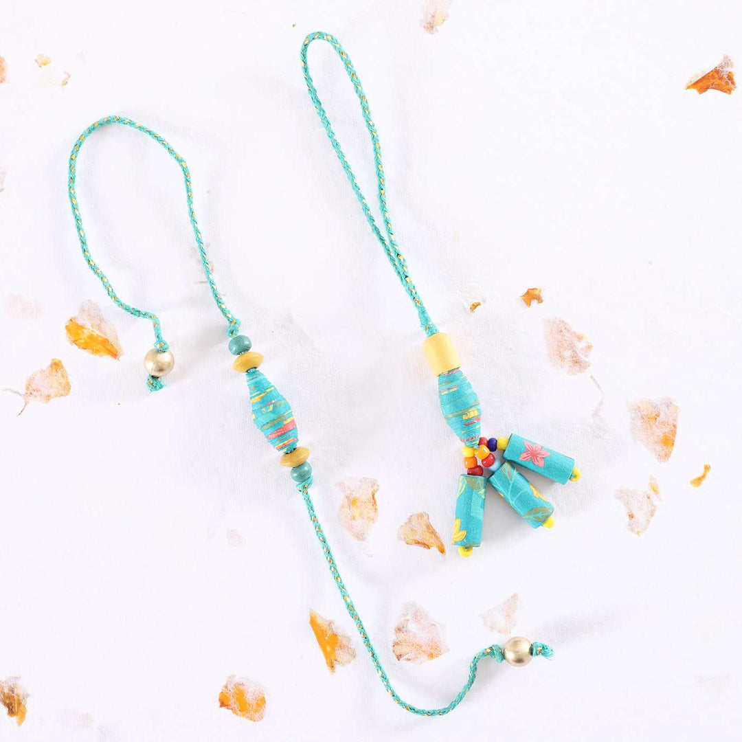 Handmade Beaded Paper Bead Bhaiya Bhabhi Rakhi With Roli Chawal Set Of 2 - Flat Lay with Light Background