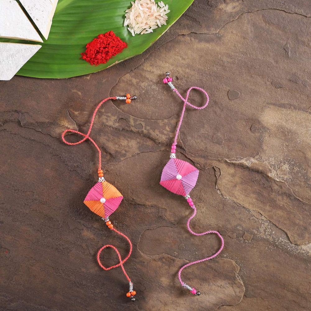 Handmade Beaded Paper Cushion Rakhi With Roli Chawal Set Of 2 - Flat Lay with Traditional Items