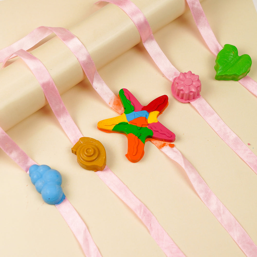 Reusable Non Toxic Nature Theme Wax Kids Rakhi Set Of 5 - Flat Lay with Curved Ribbon Arrangement