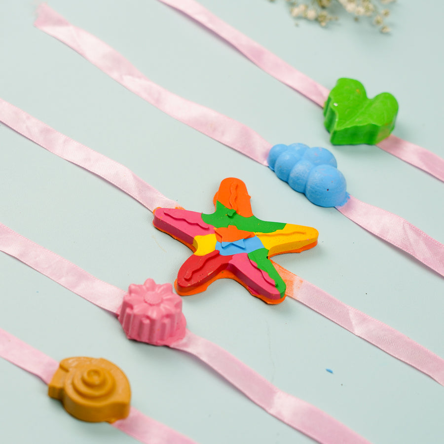 Reusable Non Toxic Nature Theme Wax Kids Rakhi Set Of 5 - Top Down Display of Charms