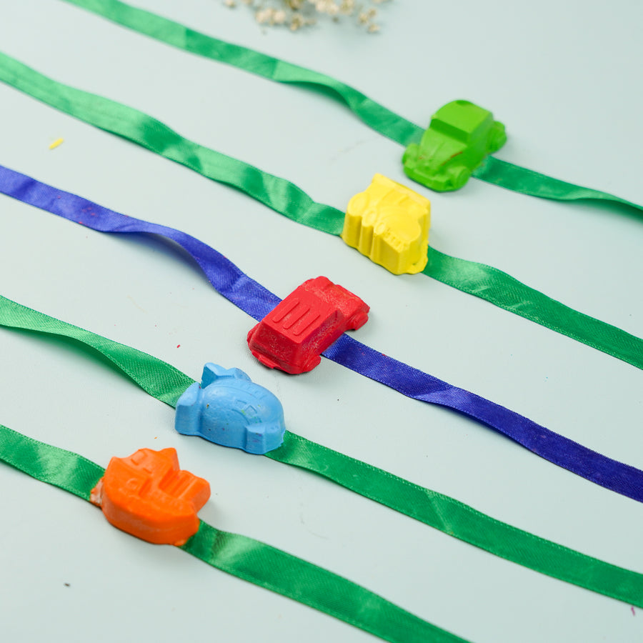 Reusable Non Toxic Vehicle Theme Wax Kids Rakhi Set Of 5 - Close-up on colorful vehicle toys