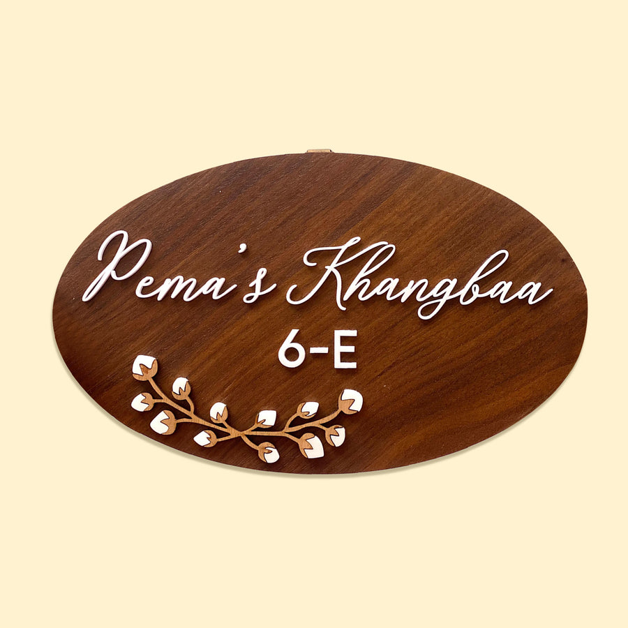 Personalised Wooden Oval Floral Name Plate - Front View on Neutral Background