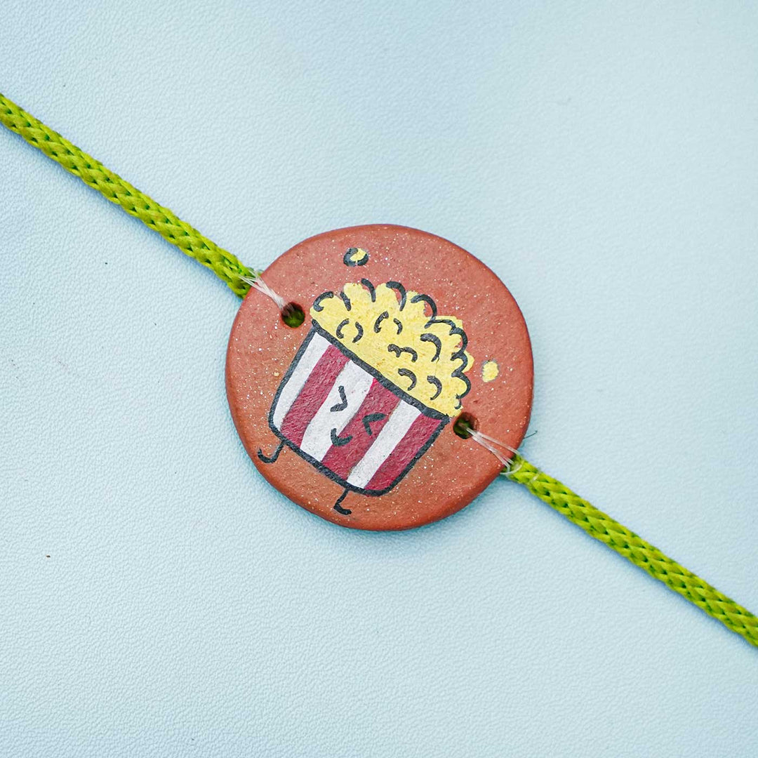 Hand Painted Terracotta Rakhi With Roli Chawal - Close-up Front View