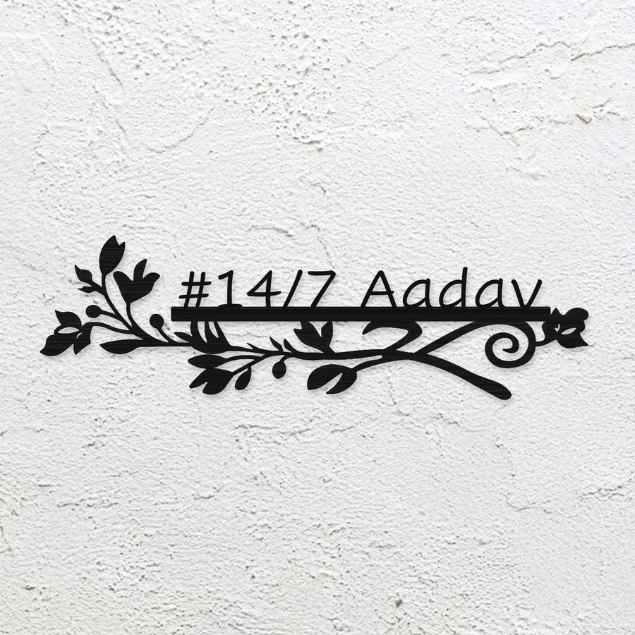 Personalized Laser Cut Sleek Floral Design Steel Name Plate - Mounted on Rough White Wall