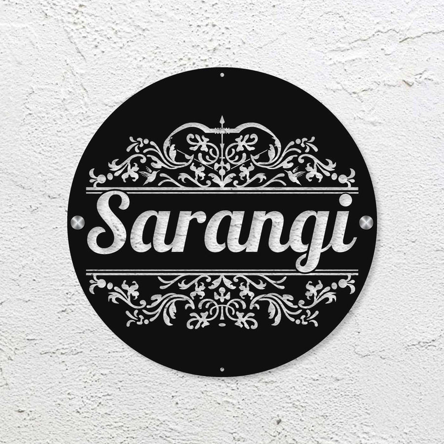 Personalized Laser Cut Round Steel Name Plate 2 - Mounted on White Textured Wall