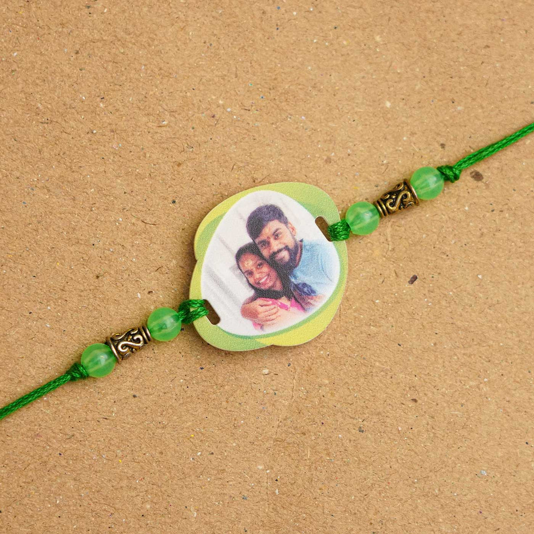 Photo Personalized Handmade Photo Acrylic Rakhi With Roli Chawal - Close-up of green photo rakhi