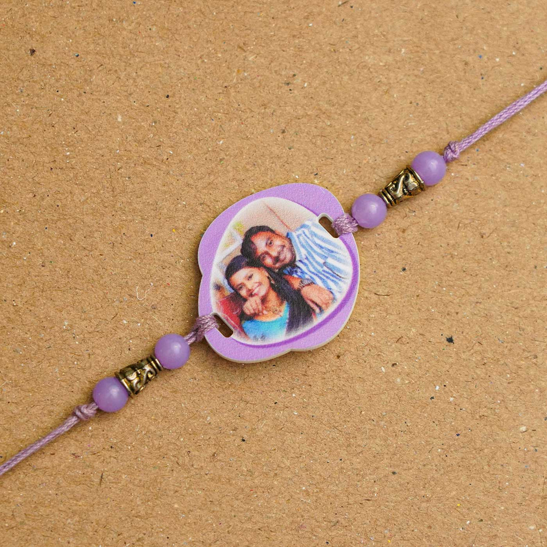 Photo Personalized Handmade Photo Acrylic Rakhi With Roli Chawal - Close-up of purple photo rakhi