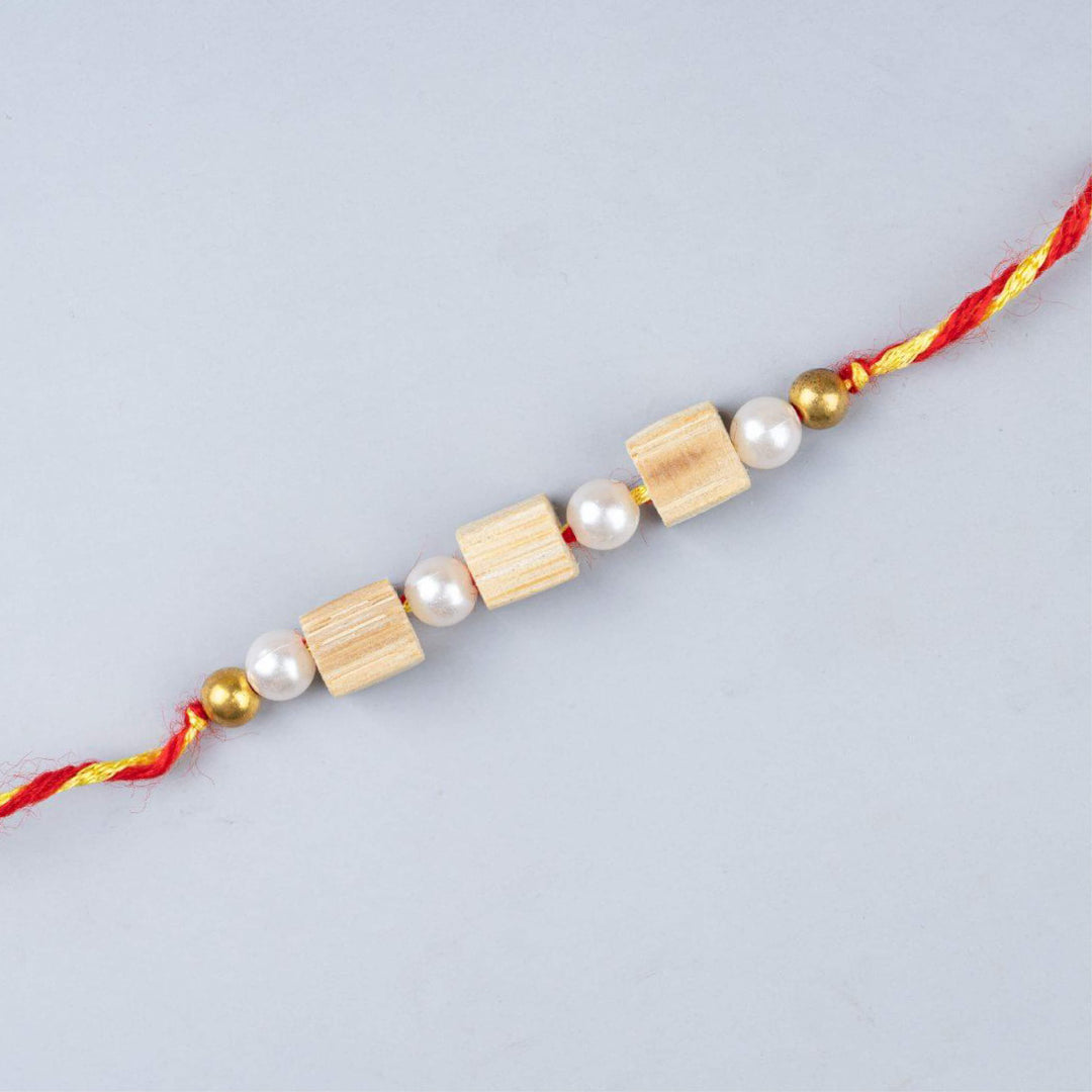 Ecofriendly Bamboo Rakhi With Roli Chawal 6 - Close-up of string beads
