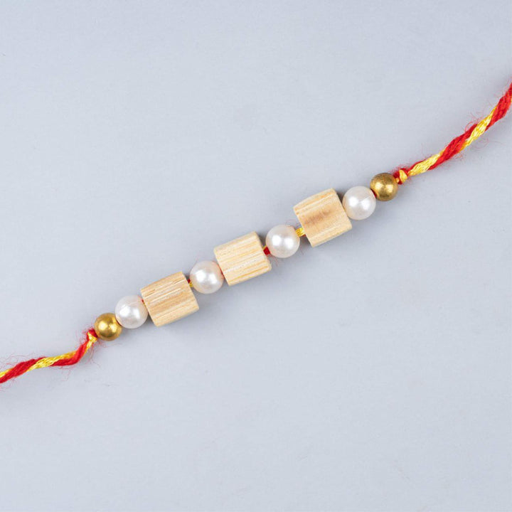 Ecofriendly Bamboo Rakhi With Roli Chawal 6 - Close-up of string beads