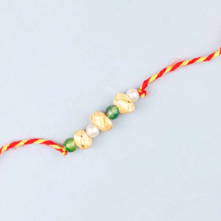 Ecofriendly Bamboo Rakhi With Roli Chawal 6 - Single rakhi close-up arranged horizontally