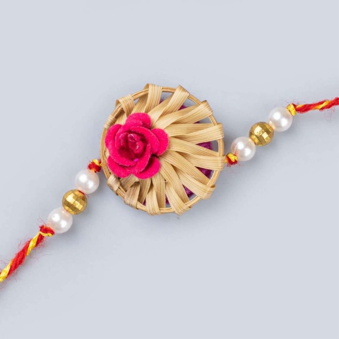 Ecofriendly Bamboo Rakhis For Bhaiya Bhabhi With Roli Chawal 7 - Close-up of Red Flower Rakhi