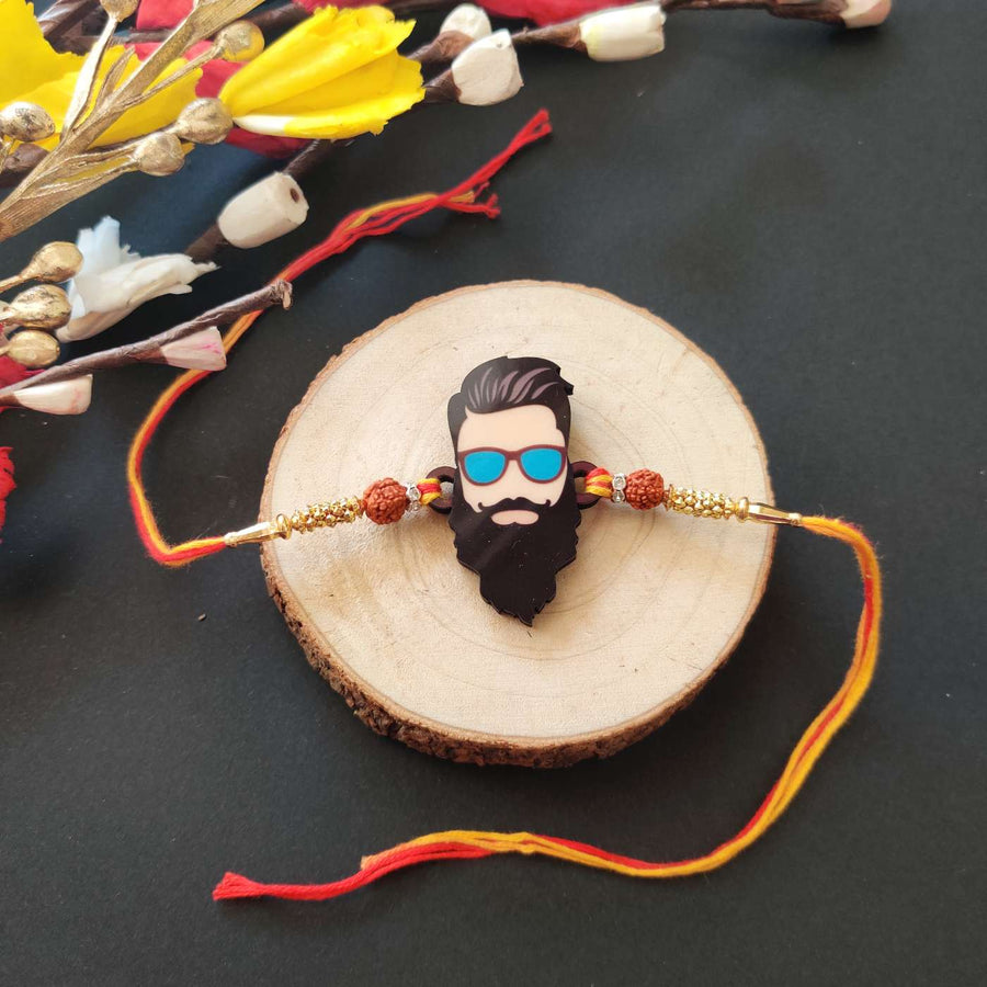 Handmade Printed Dashing Bhai Wooden Rudraksha Rakhi With Roli Chawal - Front View on Wooden Display