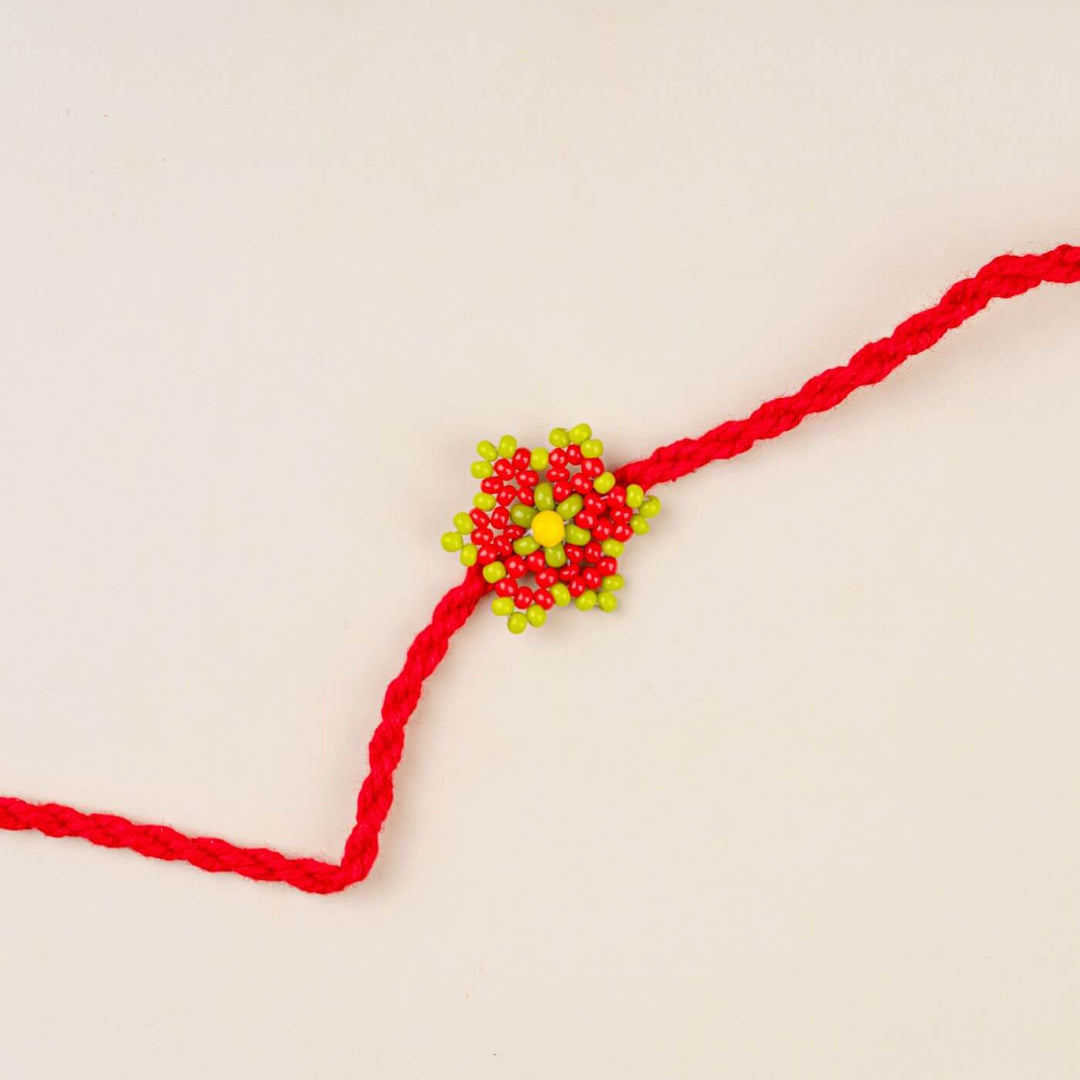 Handcrafted Glass Beads Sitara Rakhi 7 - Close-up of red and green rakhi