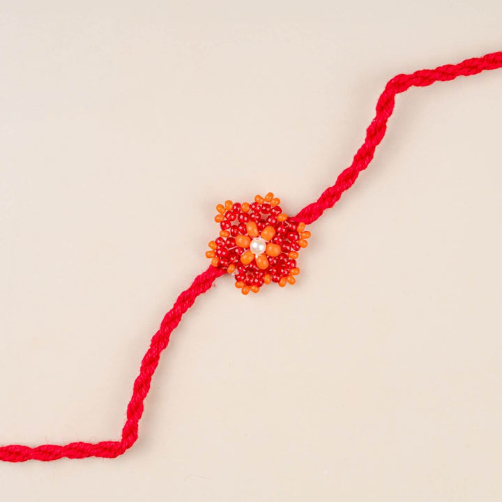 Handcrafted Glass Beads Sitara Rakhi 3 - Front View with Orange Beads