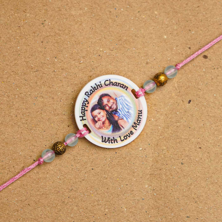 Photo Personalized Handmade Rainbow Acrylic Rakhi With Roli Chawal - Close-up of personalized rakhi