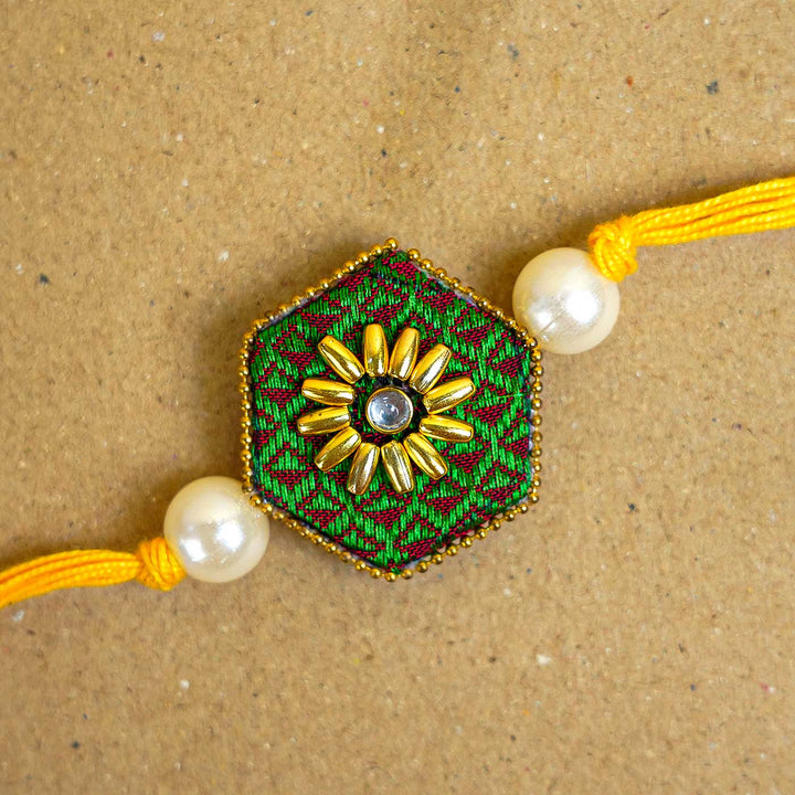 Handmade Green Hexagon Fabric And Mdf Rakhi With Roli Chawal - Close-up of single rakhi