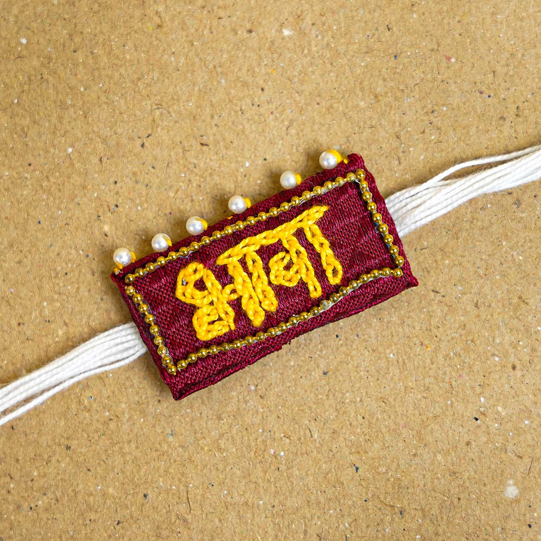 Handmade Bhava Fabric And Mdf Rakhi With Roli Chawal - Close-up Front View