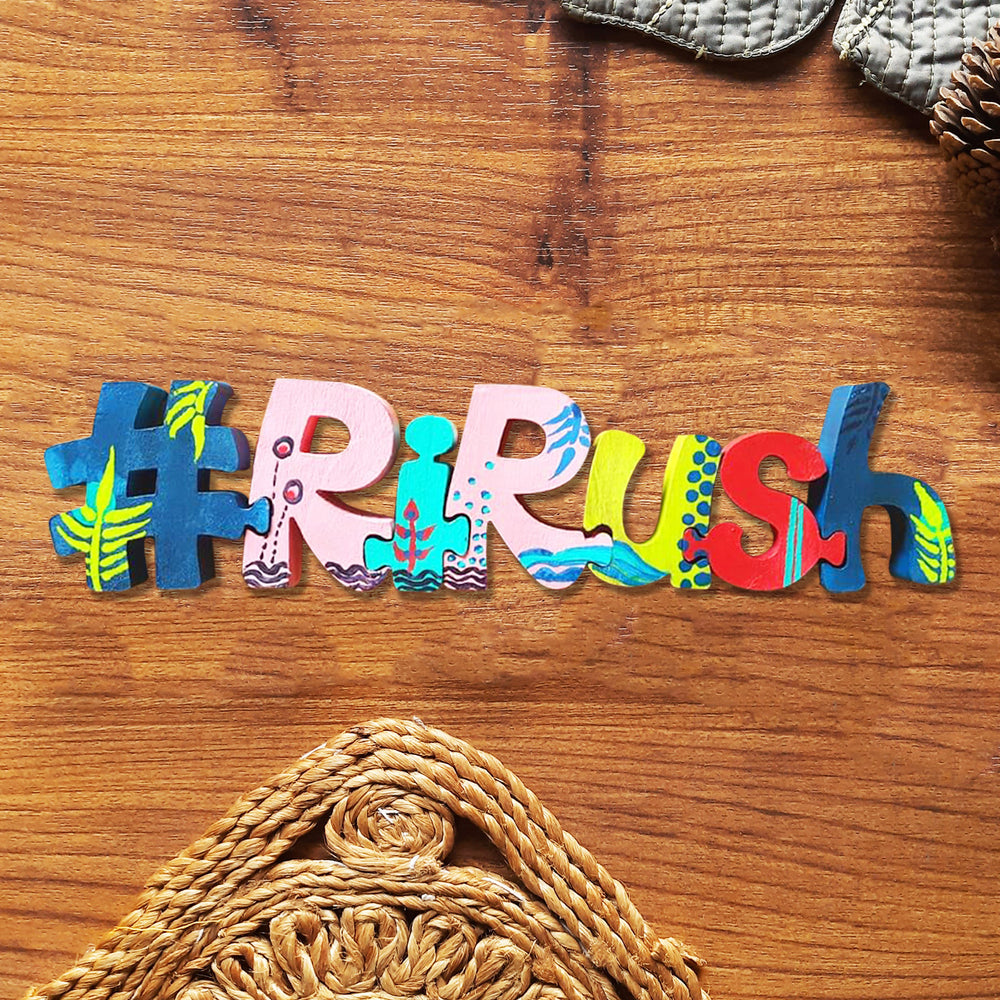 Hand Painted Wooden Jigsaw Name Blocks For Wedding Celebrations - Top-down View on Wooden Surface