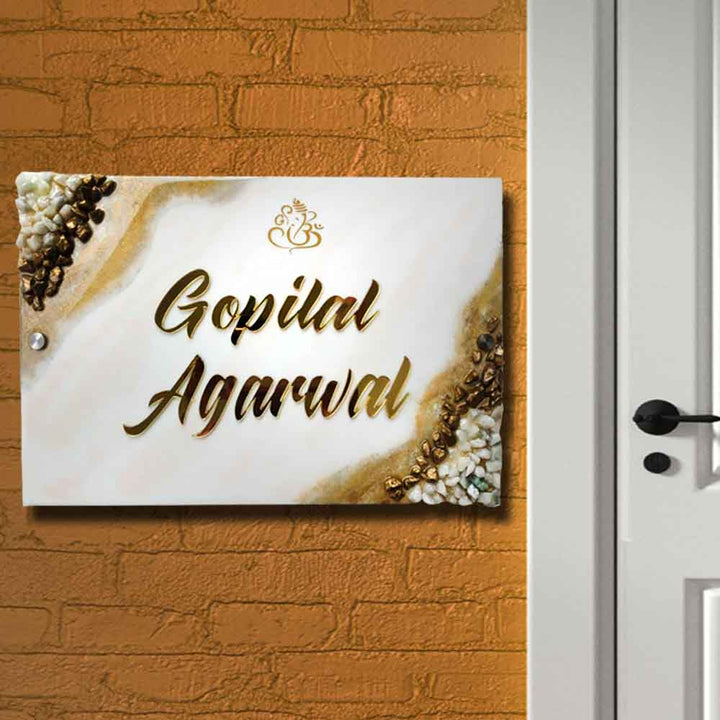 Personalized Handmade Ganesha Resin Name Plate - Mounted on Brick Wall Side View