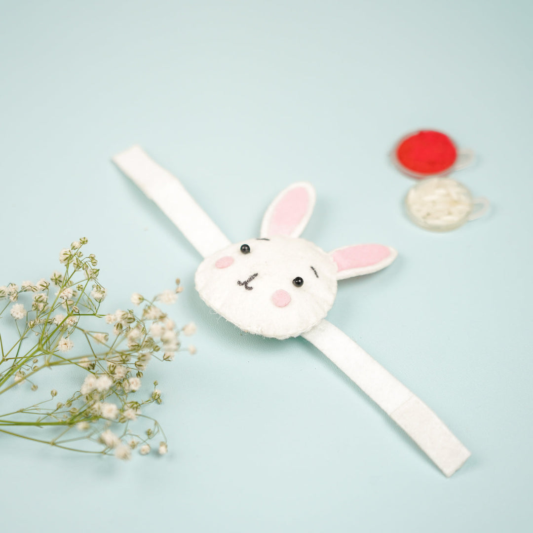 Handmade Bunny Theme Felt Kids Rakhi With Roli Chawal - Top View with Props