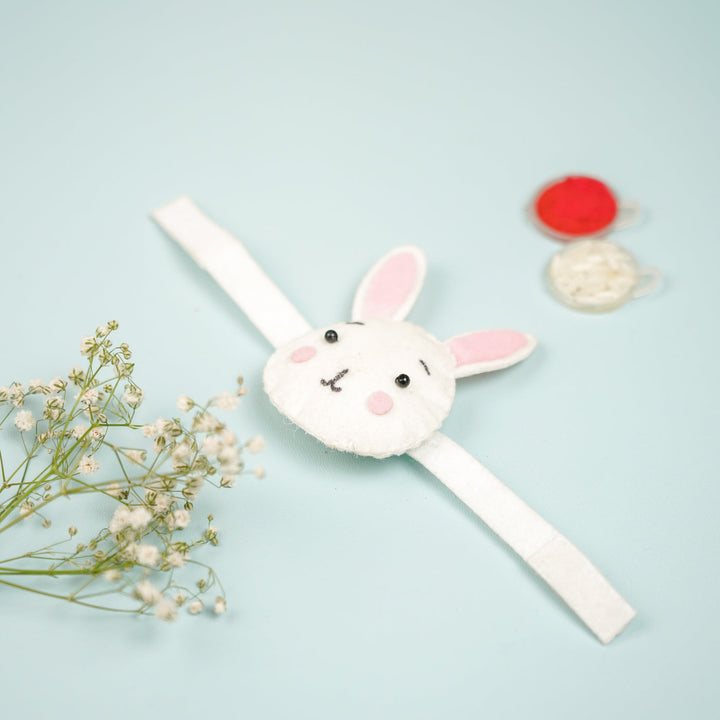 Handmade Bunny Theme Felt Kids Rakhi With Roli Chawal - Top View with Props