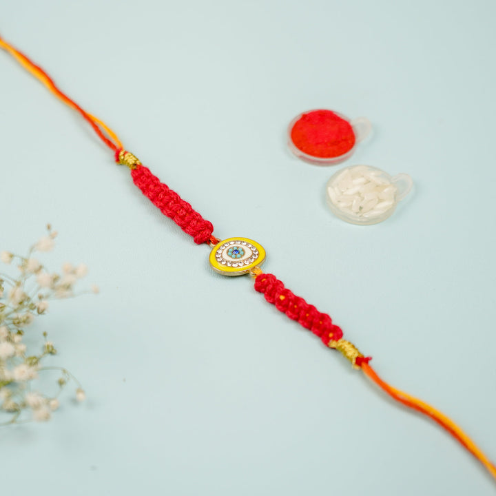 Customized Handmade Macrame Evil Eye Metal Rakhi With Roli Chawal - Flat lay with accessory items (7)