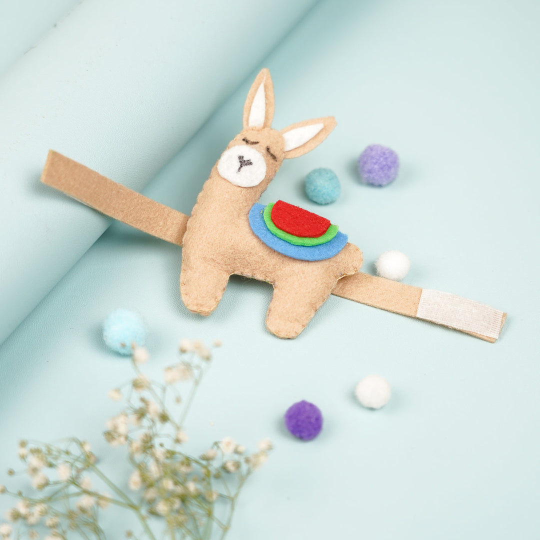 Handmade Lama Theme Felt Kids Rakhi With Roli Chawal - Top View with Decorative Elements