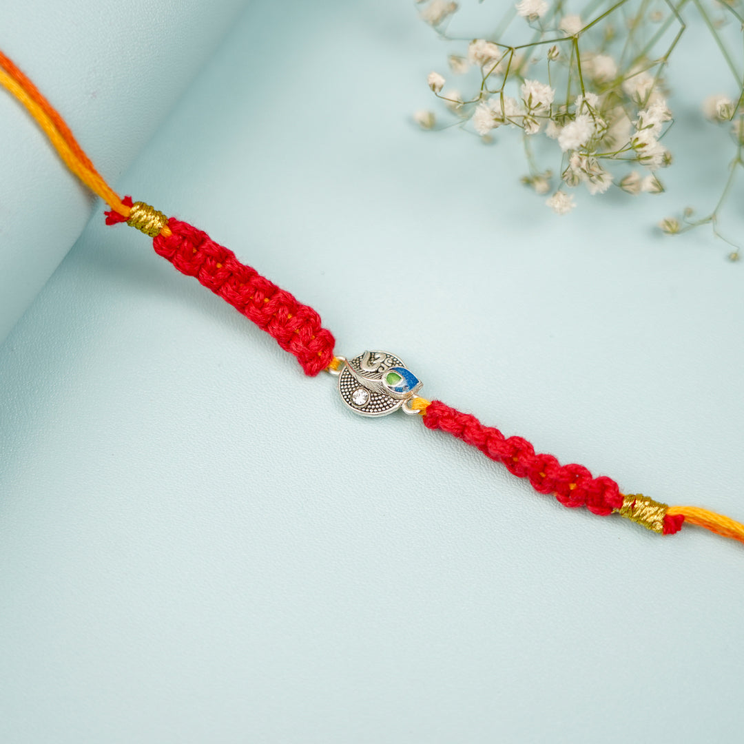 Handmade Macrame Religious Om Theme Metal Rakhi With Roli Chawal - Close-up of Bracelet Design