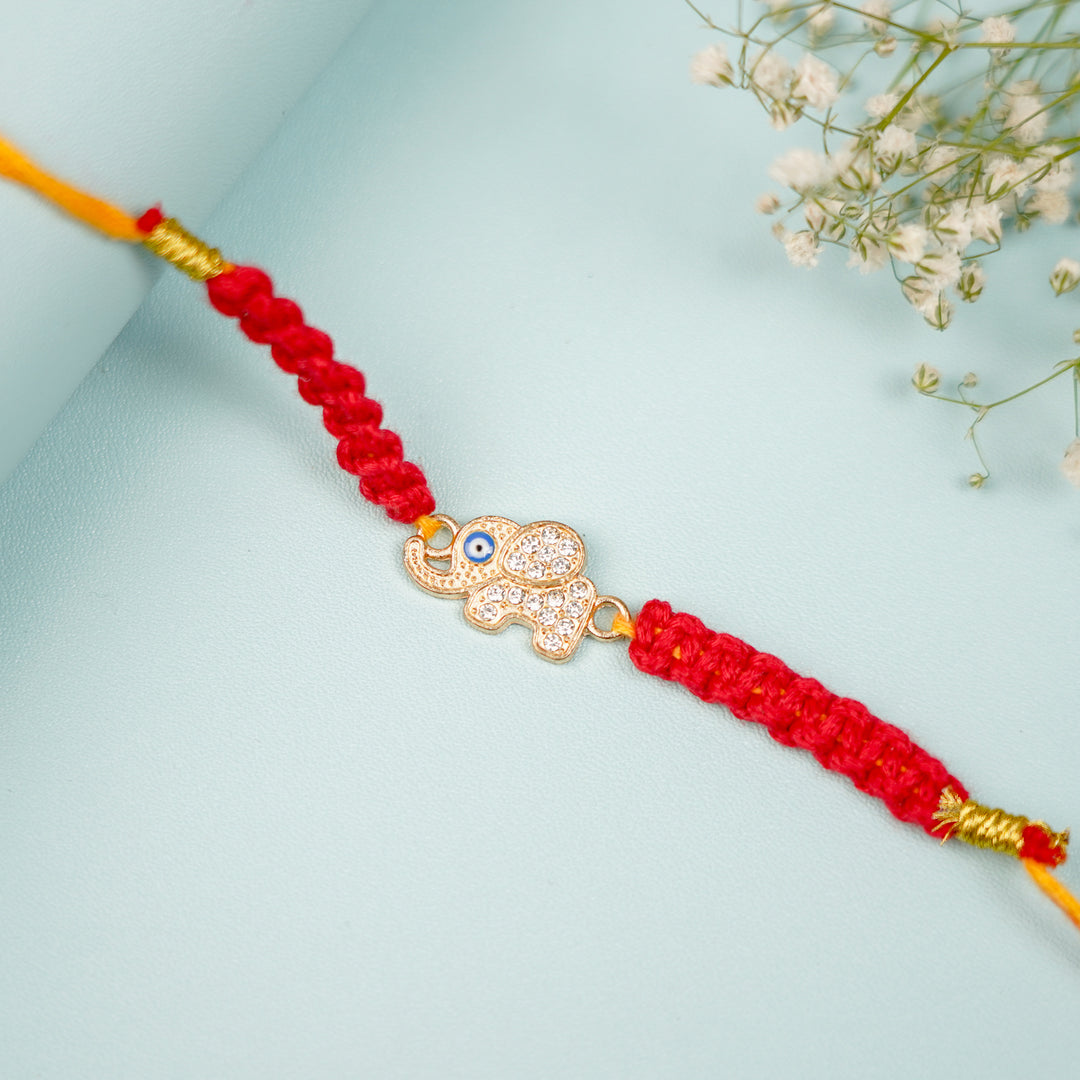 Handmade Macrame Elephant Evil Eye Metal Rakhi With Roli Chawal - Close-up of Elephant Charm Bracelet
