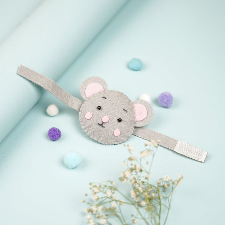 Handmade Koala Theme Felt Kids Rakhi With Roli Chawal - Flat Lay with Decorative Pom Poms