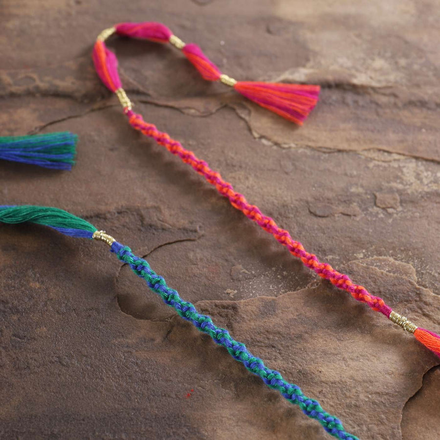 Handmade Beaded Spiral Rakhi With Roli Chawal Set Of 2 - Angled Close-up View