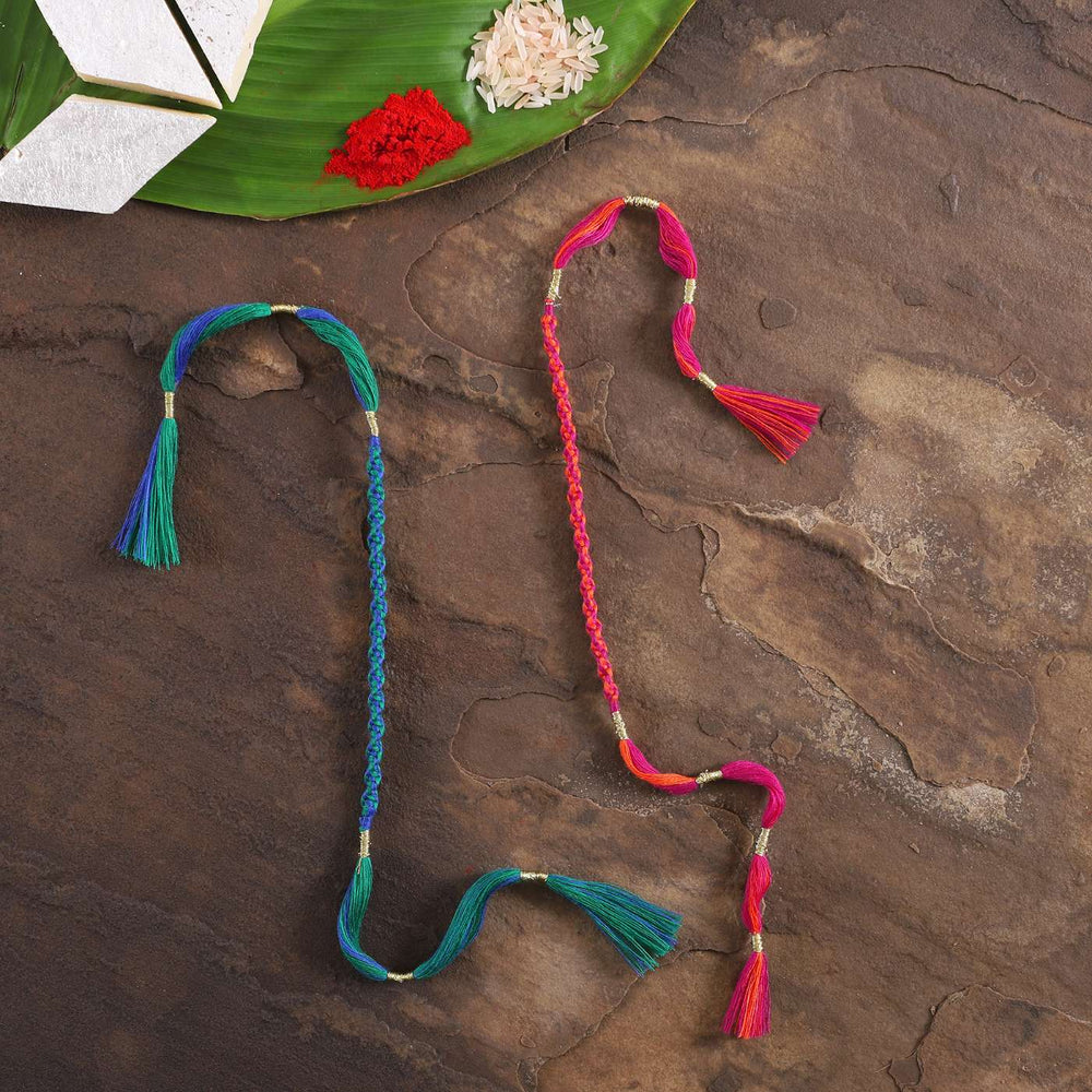 Handmade Beaded Spiral Rakhi With Roli Chawal Set Of 2 - Flat Lay with Decorative Elements