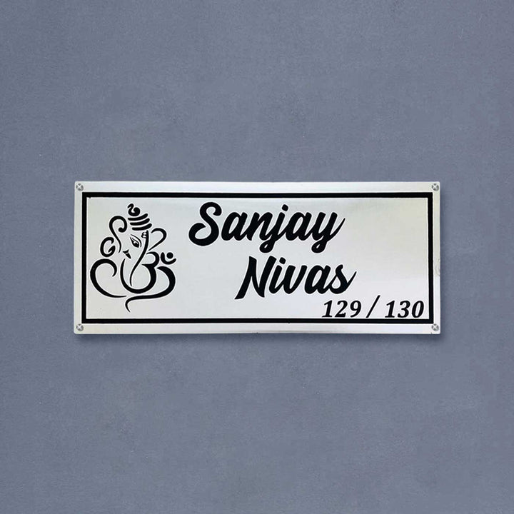Personalized Waterproof Rectangle Ganesha Theme Steel Name Plate - Front View on Wall Background