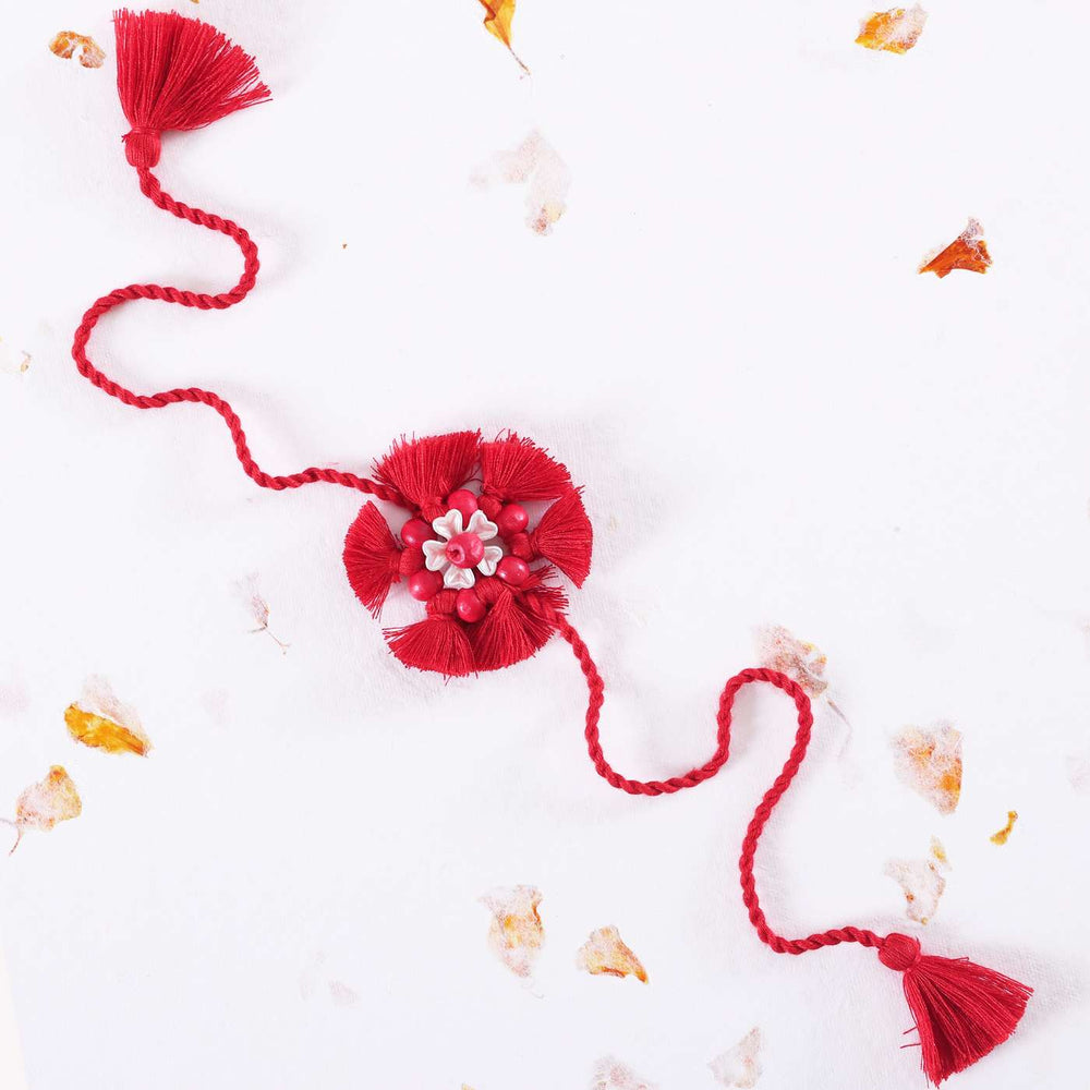 Handmade Beaded Tassel Flower Cotton Rakhi With Roli Chawal 1 - Full view on white background