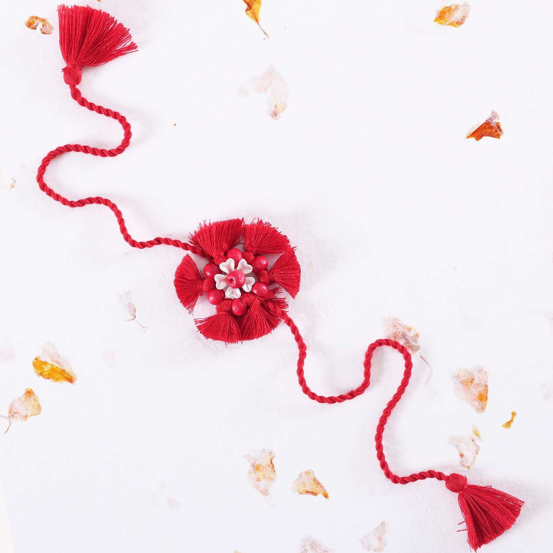 Handmade Beaded Tassel Flower Cotton Rakhi With Roli Chawal 1 - Full view on white background