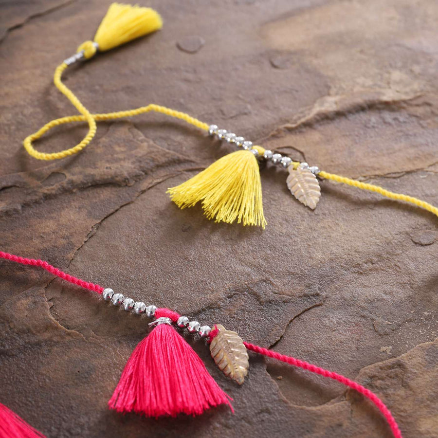 Handmade Yellow And Red Tassel Rakhi With Roli Chawal Set Of 2 - Close-up of Tassel Details