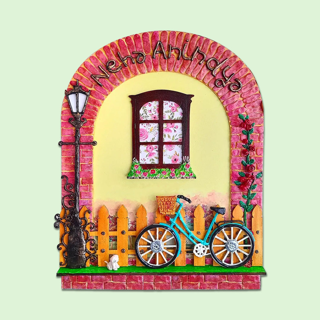 Personalized Artsy Family Name Plate With Miniature Elements - Front View on Green Background