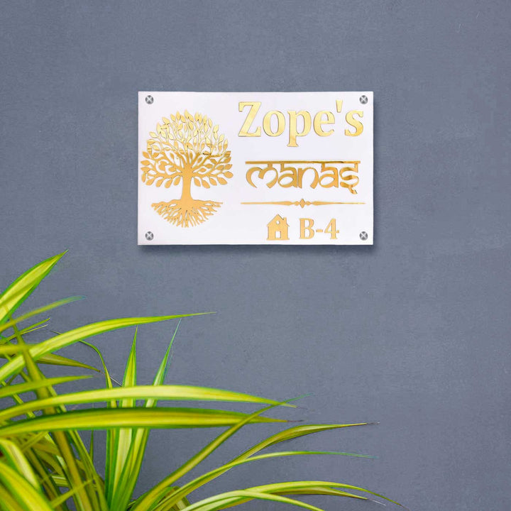 Personalized Waterproof Golden Tree Design Acrylic Led Name Plate - Mounted on Grey Wall with Plant