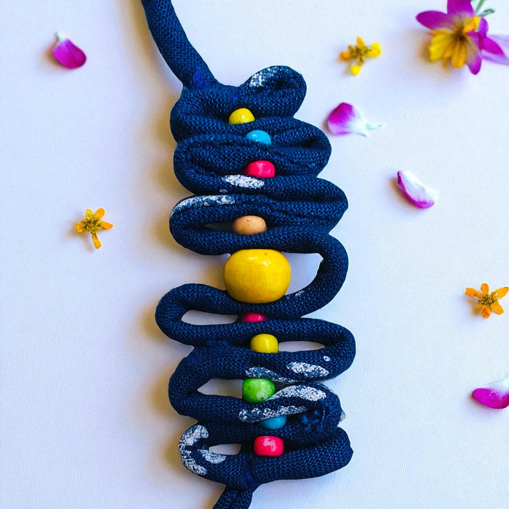 Handmade Blue Zig Zag Upcycled Fabric Rakhi With Roli Chawal For Brother - Close-up of Beaded Detail