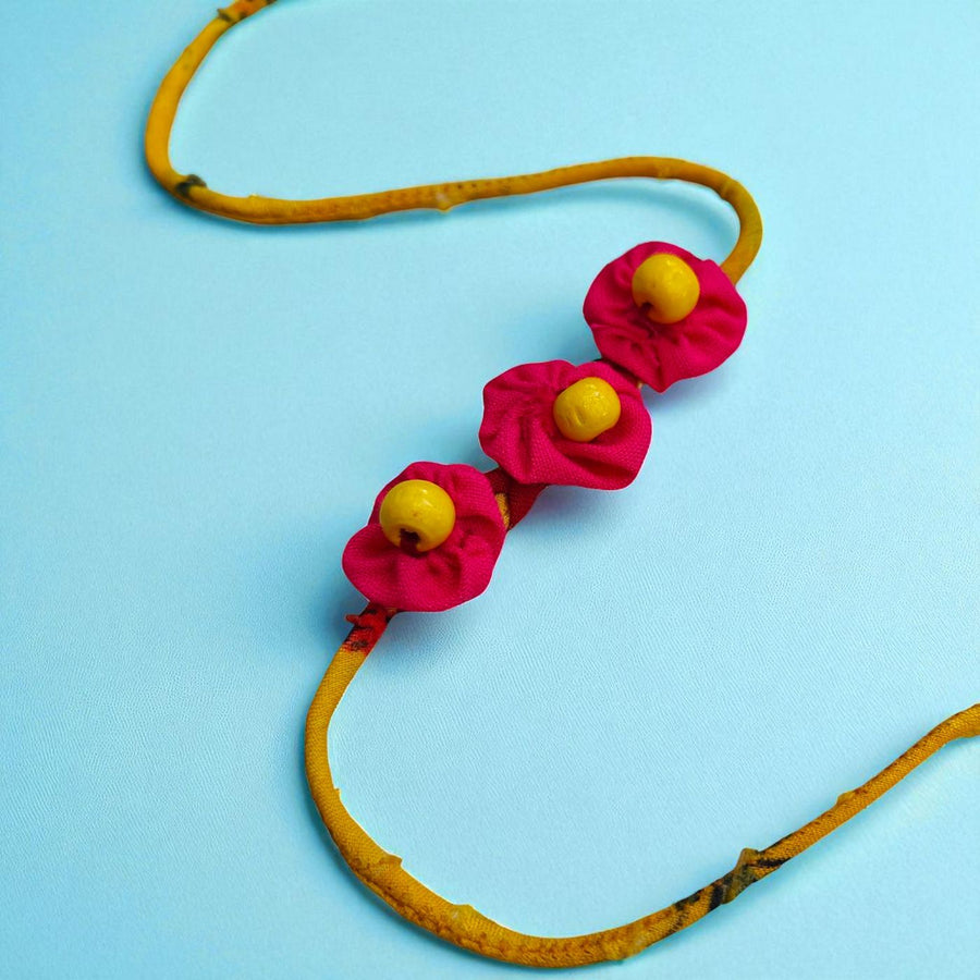Handmade Beaded Pink And Yellow Upcycled Fabric Rakhi With Roli Chawal For Brother - Decorative Flower Detail Front