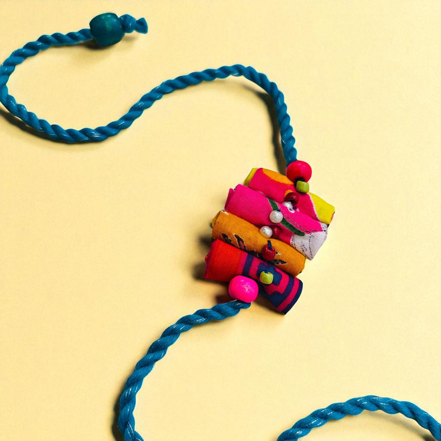 Handmade Beaded Roll Stacked Design Upcycled Fabric Rakhi With Roli Chawal For Brother - Full Necklace Display