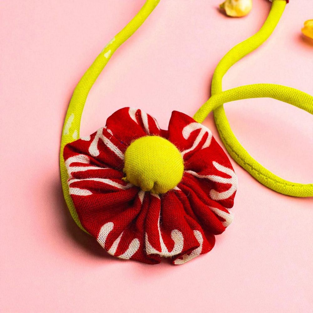 Handmade Floral Pom Pom Upcycled Fabric Rakhi With Roli Chawal For Brother - Close-up of Flower Detail