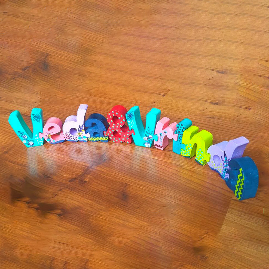 Hand Painted Wooden Jigsaw Name Blocks For Twins - Front View of Colorful Letters Arrangement