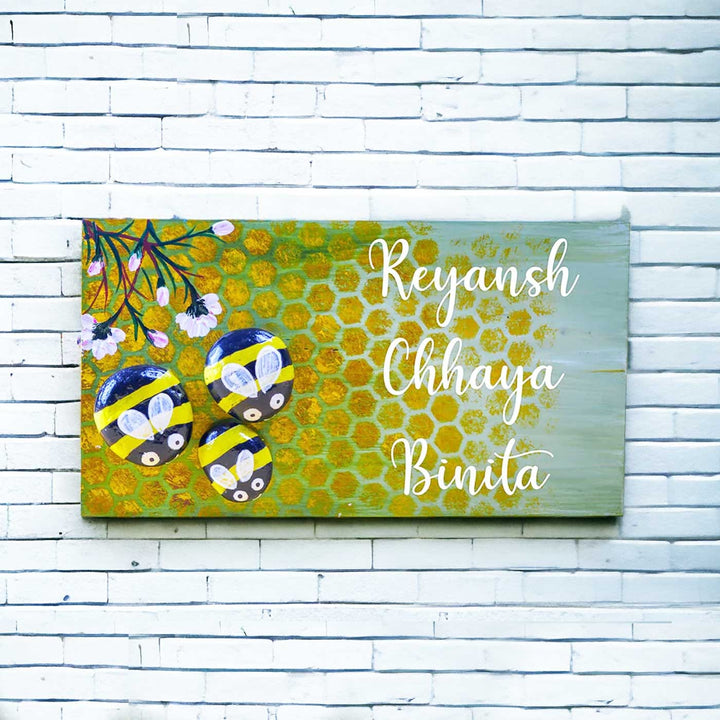 Hand Painted Pebble Name Plate Honey Bees - Mounted on White Brick Wall