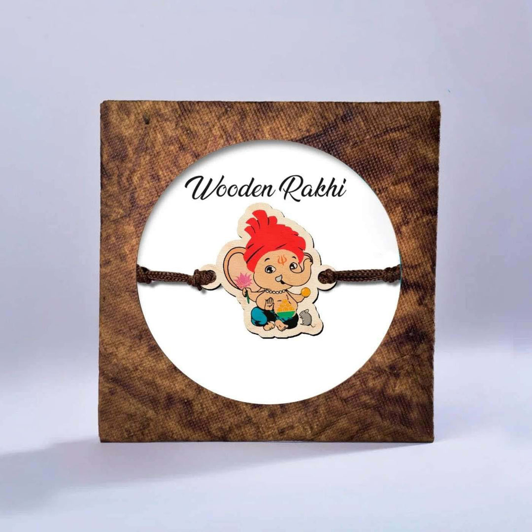 Handmade Ganapati Wooden Kids Rakhi With Roli Chawal - Rakhi in decorative packaging